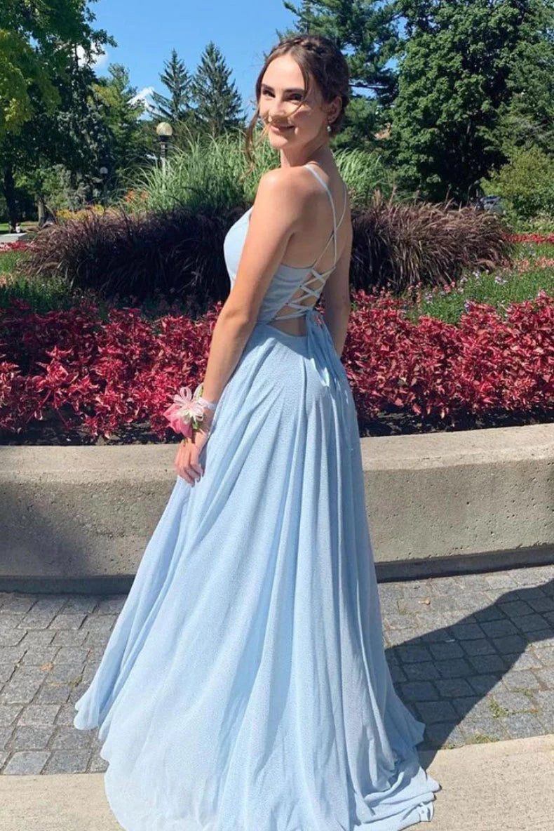 Elegant blue V-neck tulle floor-length evening gown on a model.