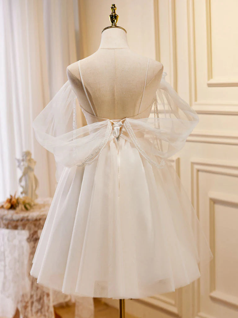 Back view of the elegant light champagne short formal dress.