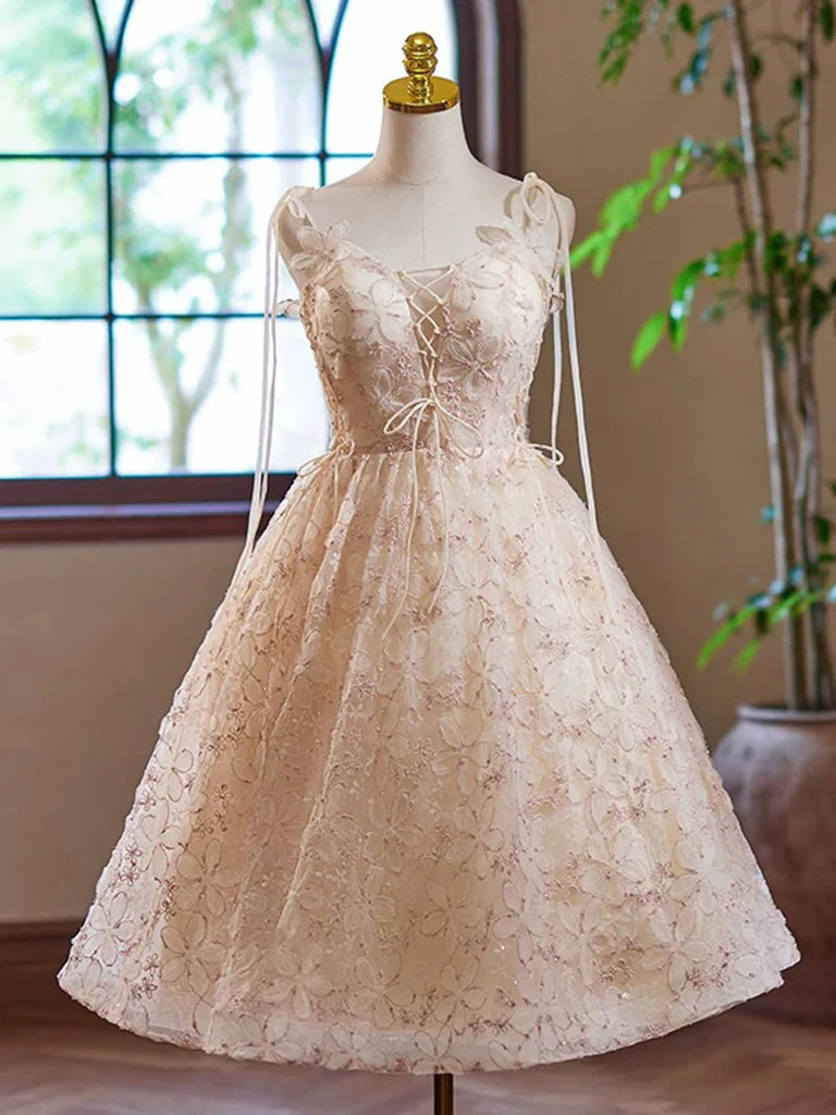 Model wearing a champagne A-line V-neck short prom dress with lace details.