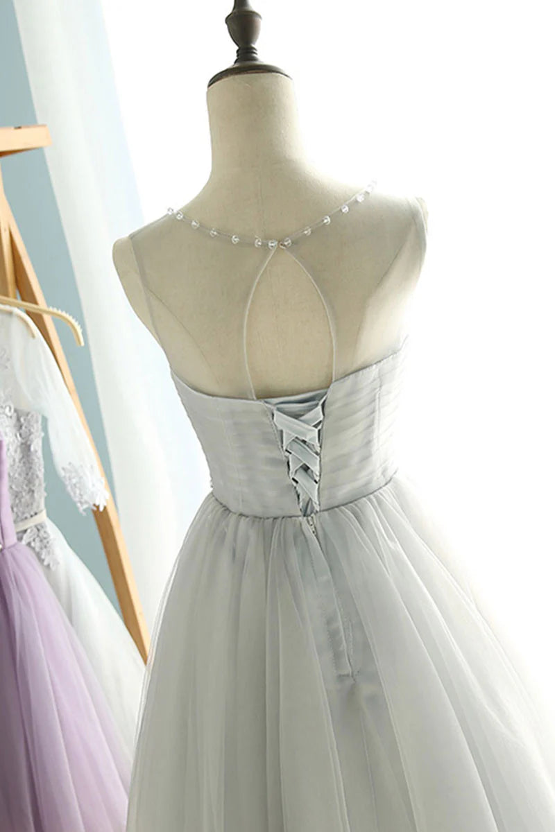 Back view of the short blush pink A-line tulle dress.