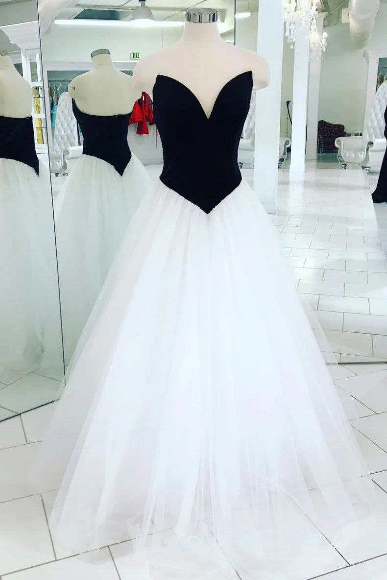 Elegant white tulle long prom dress with a V-neckline and A-line silhouette.