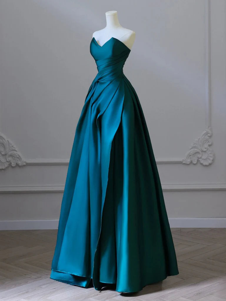 Back view of a woman wearing a sophisticated green satin long prom gown.