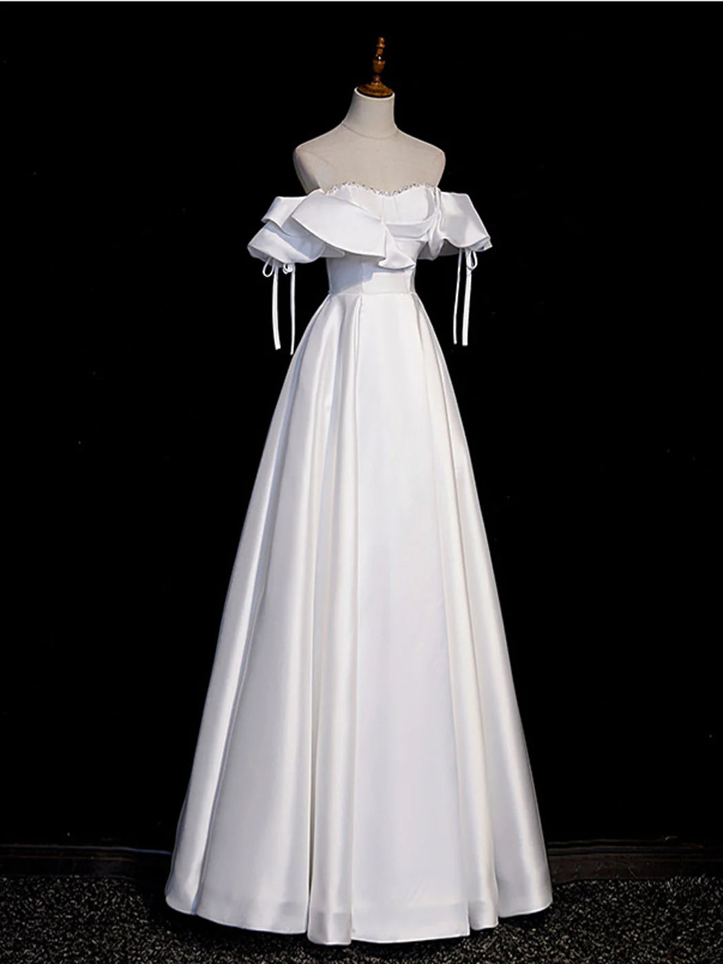 Side profile of the white A-line satin long prom dress, highlighting the silhouette.
