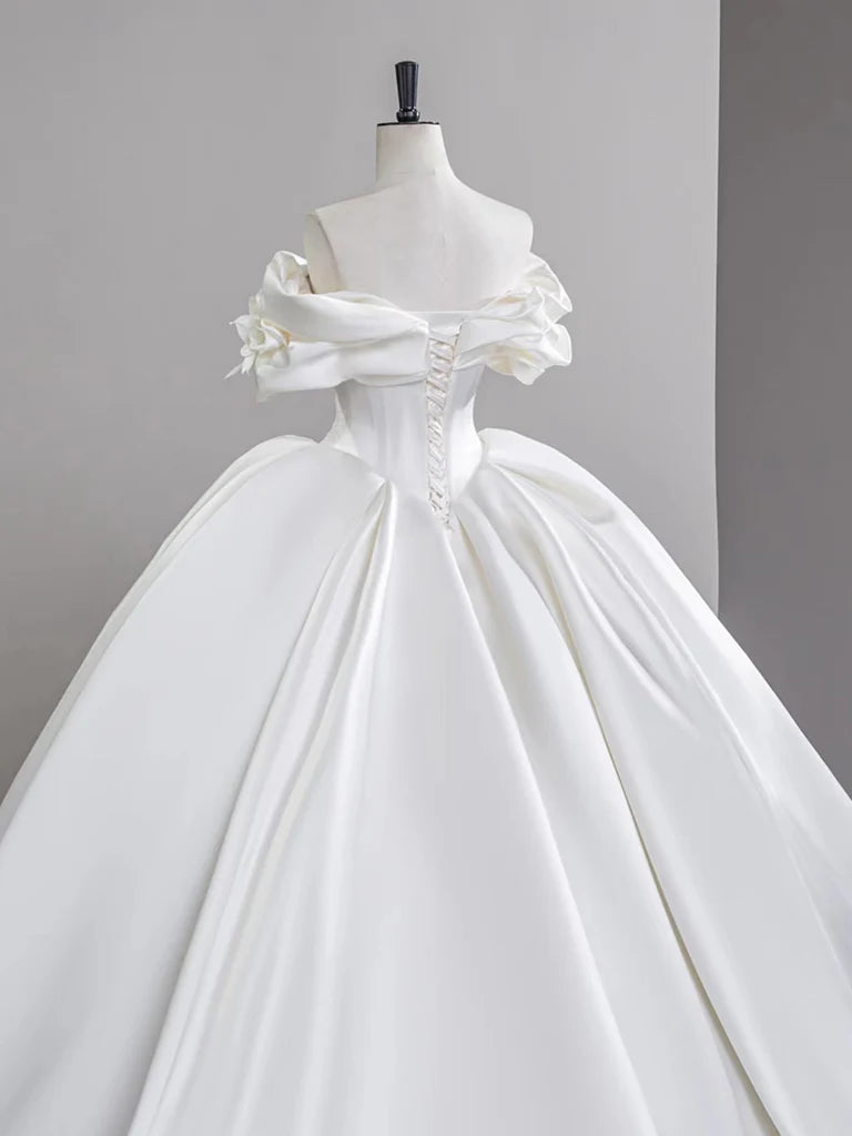 Model wearing a white A-line off-shoulder formal gown.