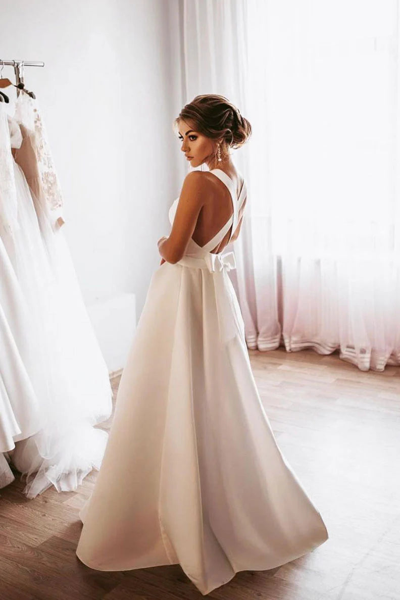 Graceful white A-line satin bridesmaid gown with open back.