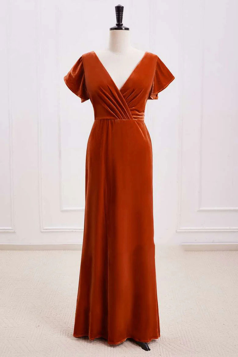 Elegant rust orange velvet A-line bridesmaid dress with surplice neck and open back, front view.