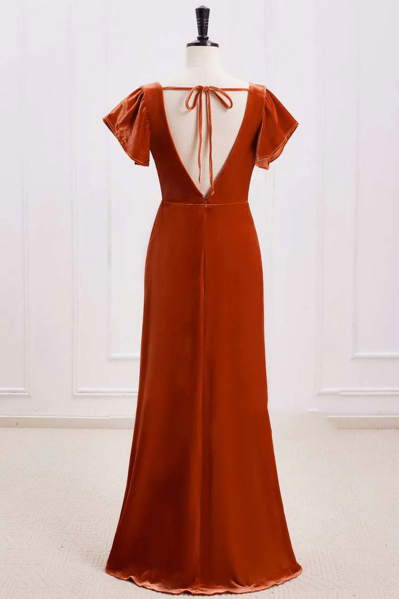 Rust orange velvet A-line bridesmaid dress with backless design, side view.