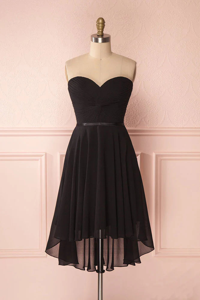 Model wearing a black sweetheart neck short chiffon A-line prom dress.