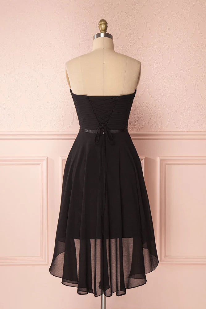 Back view of model in black sweetheart neck short chiffon formal dress.