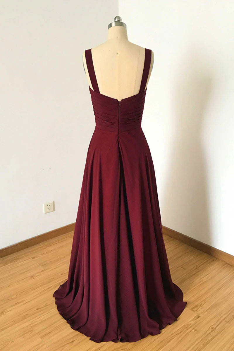 Back view of an elegant burgundy A-line V-neck evening dress on a model.