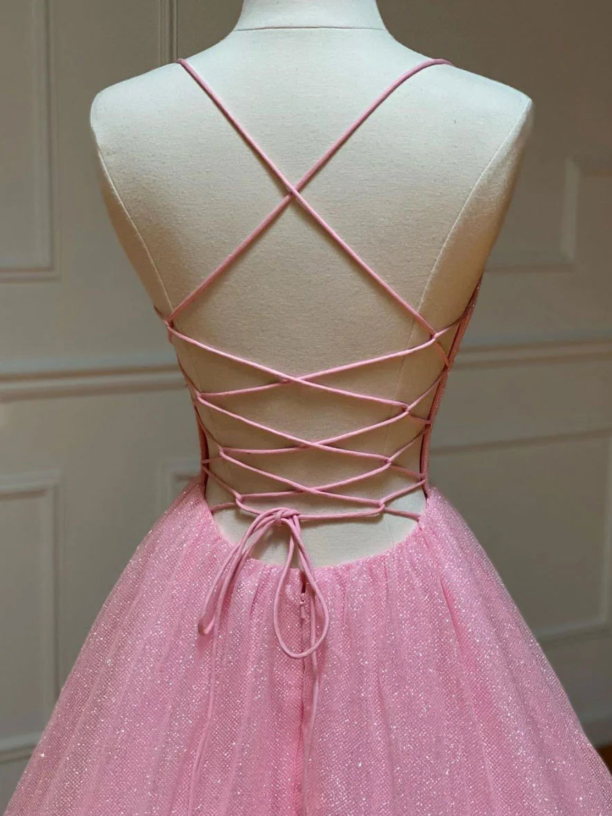 Back and side view of the pink A-line tulle prom dress on a model.