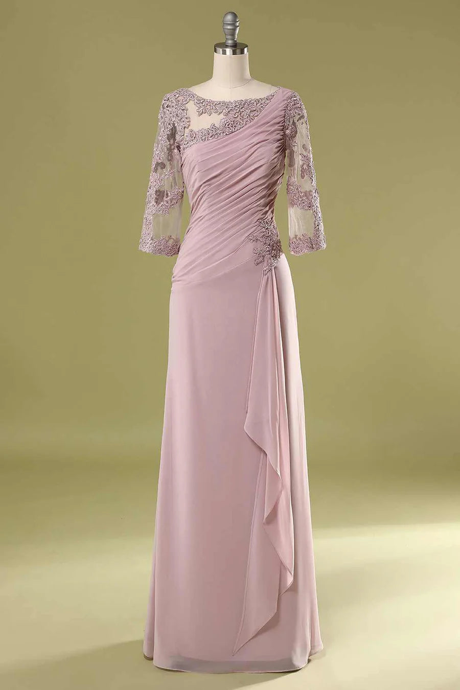 Model wearing an elegant blush pink asymmetrical ruffled half sleeve mother of the bride dress, front view.