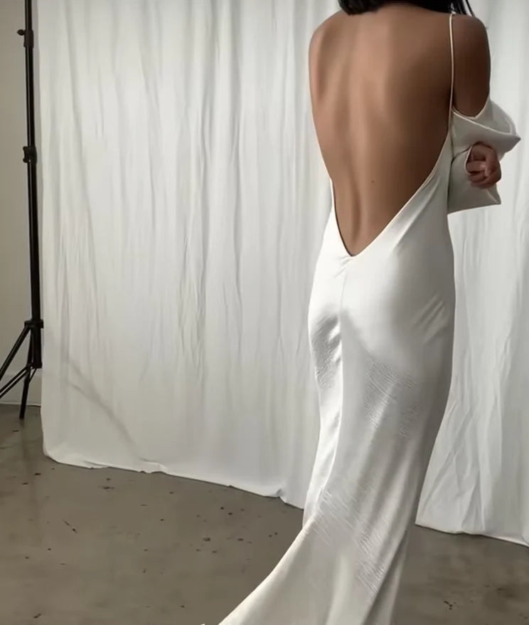 Close-up of the backless design and spaghetti straps on the mermaid wedding dress.