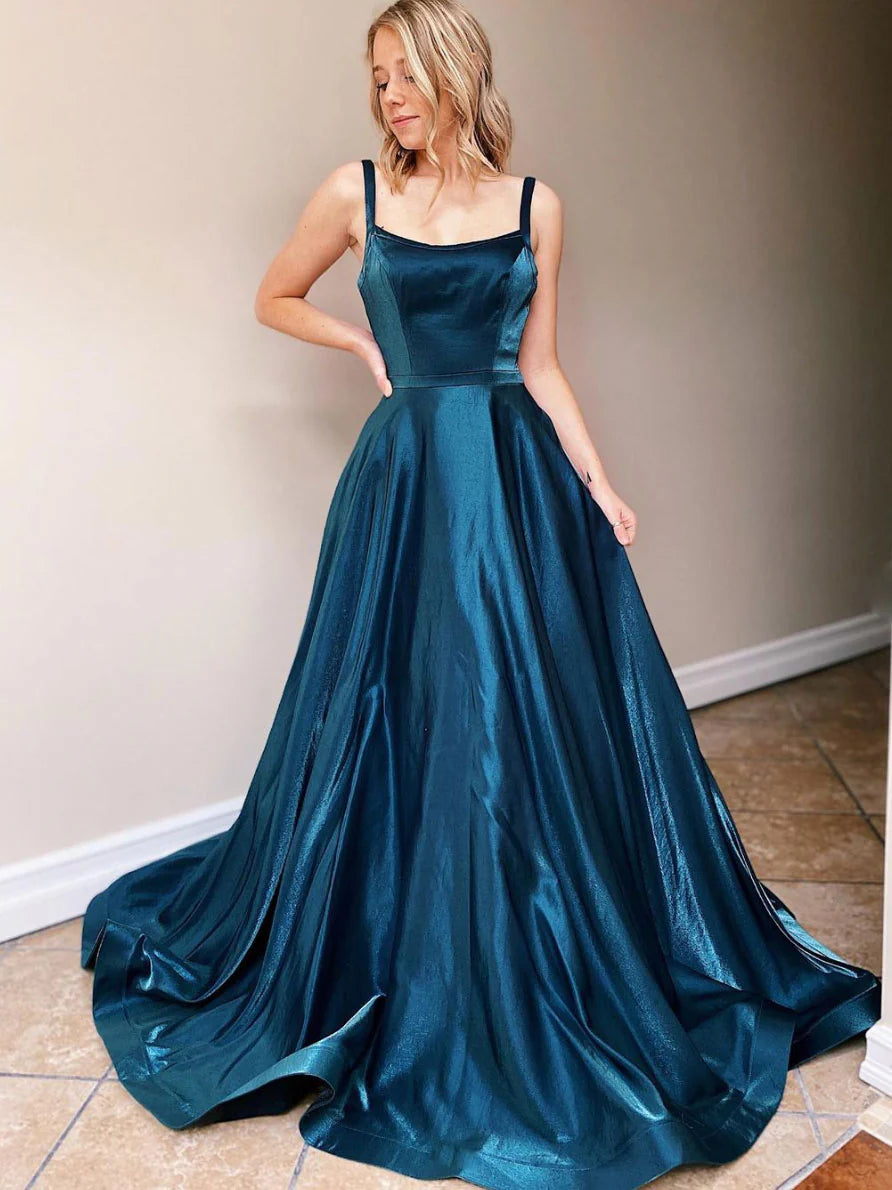 Elegant backless blue satin long prom dress, front view on a model.
