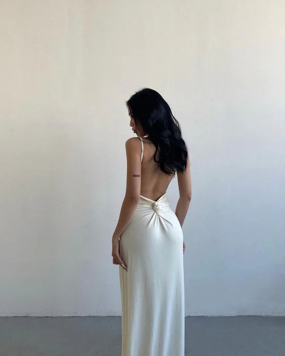 Close-up of the backless detail on the formal prom dress.