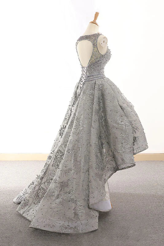Side view of a gray high-low tulle lace dress, showcasing the unique hemline.