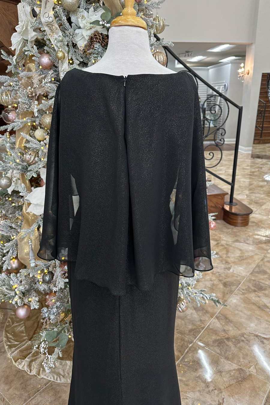 Back view of the black Mother of the Bride dress, featuring the elegant sweeping train.