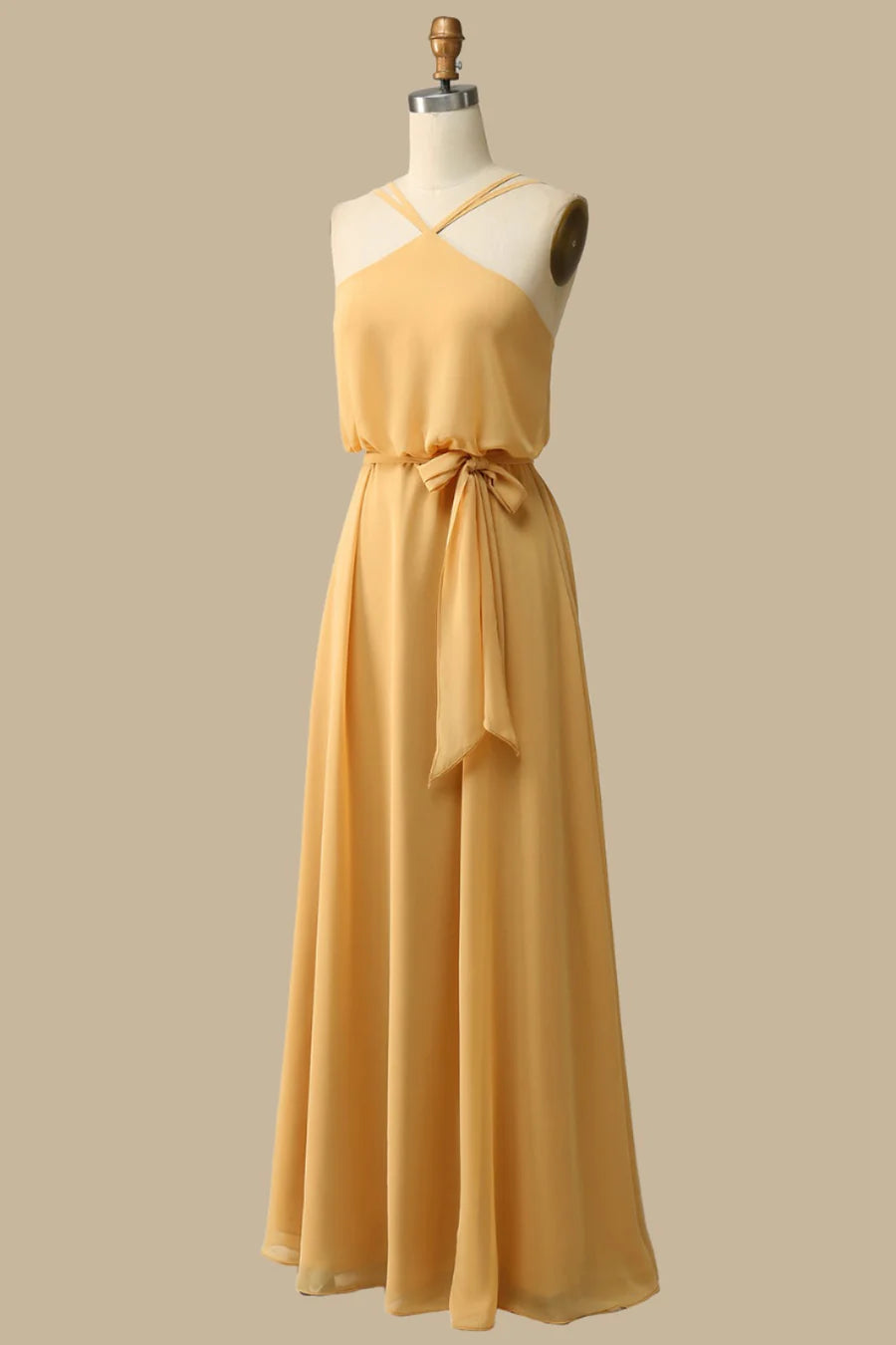 Side view of the mustard yellow chiffon maxi dress with cinched waist.