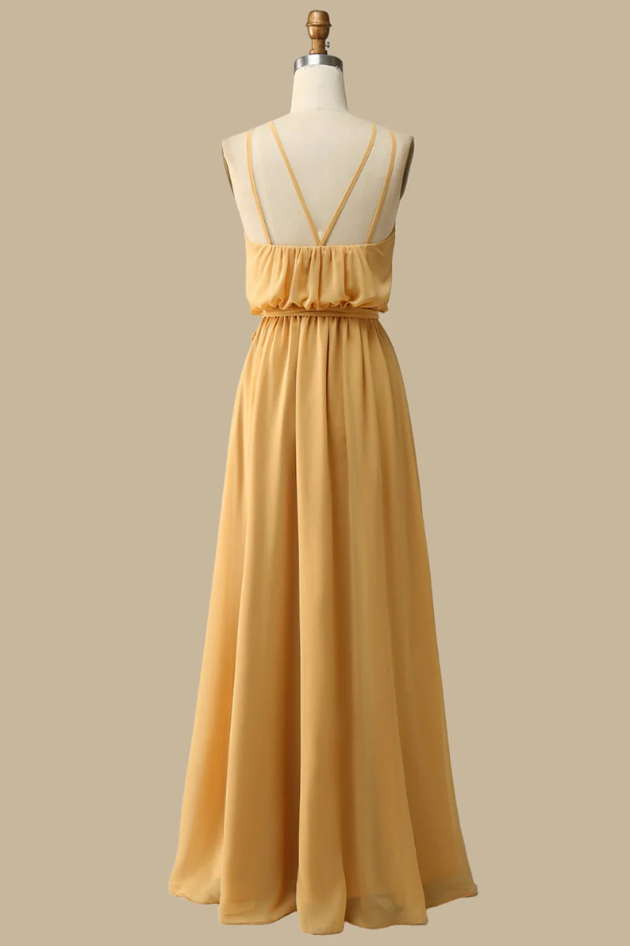 Back view of the mustard yellow halter spaghetti strap dress.