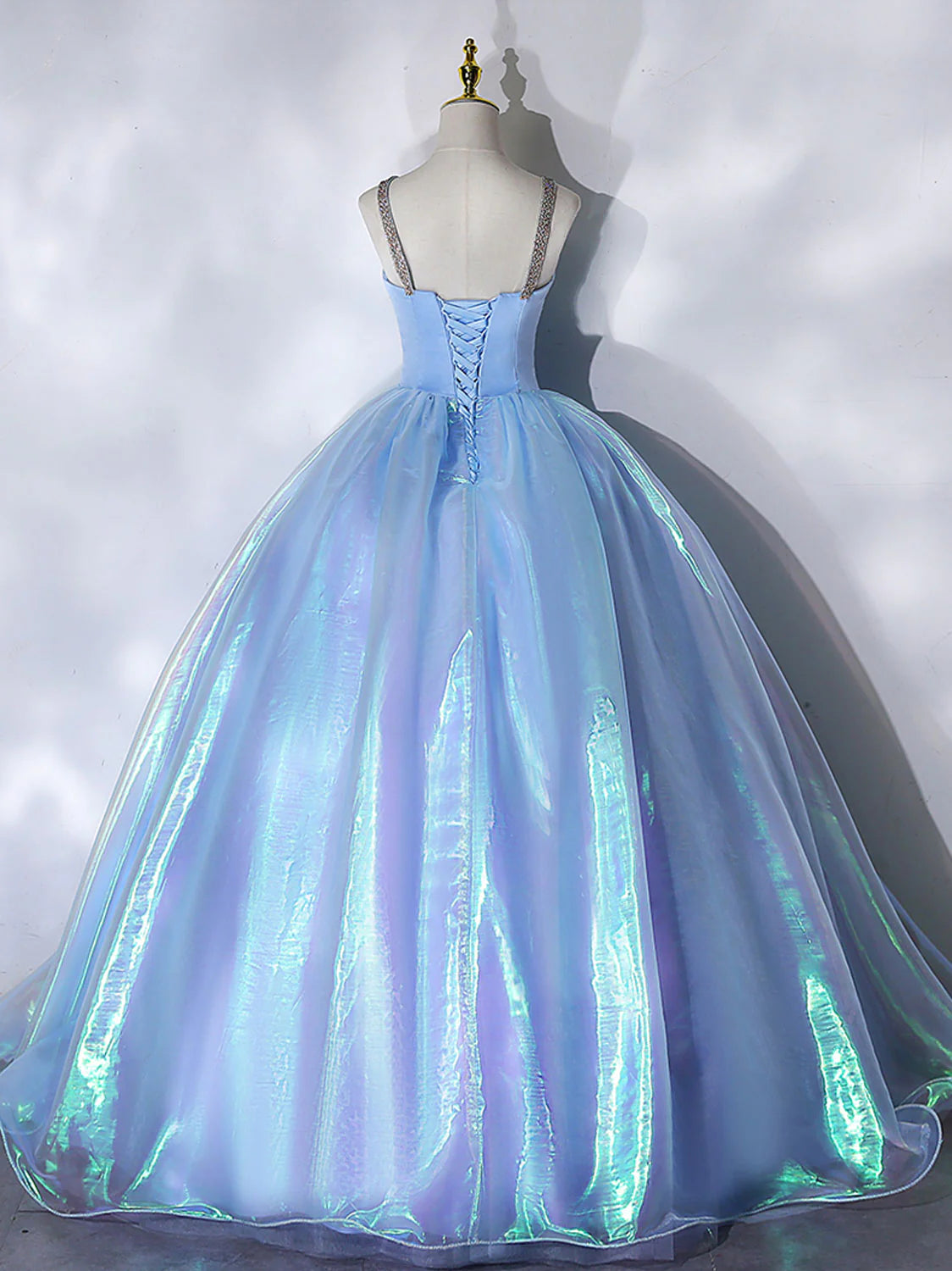 Close-up of the sweetheart neckline and bodice details of the blue prom gown.
