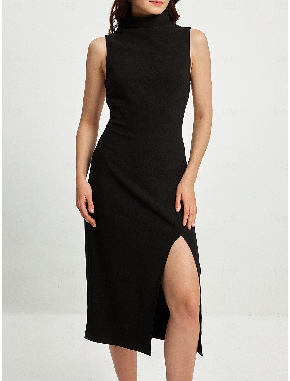 Woman modeling an elegant black high neck sleeveless midi dress with a high slit, front view.