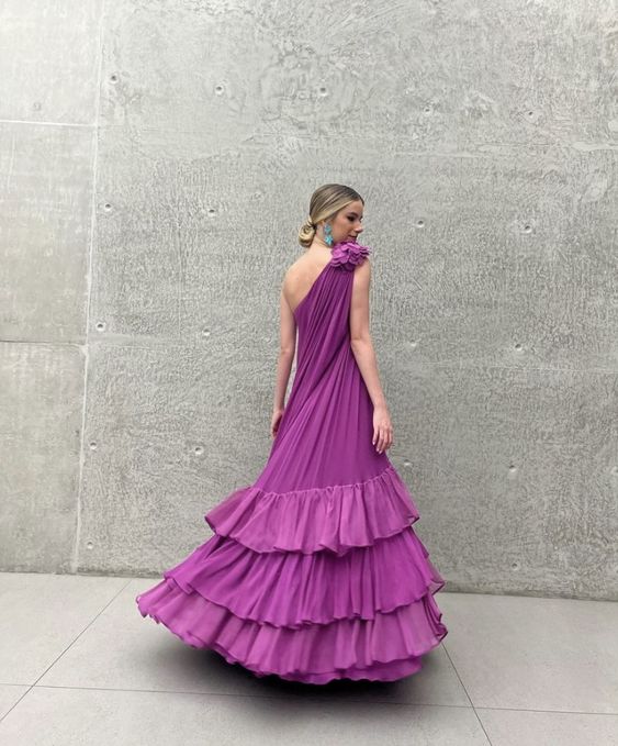 Side view of the one-shoulder ruffled chiffon prom dress, showcasing its flowing skirt.