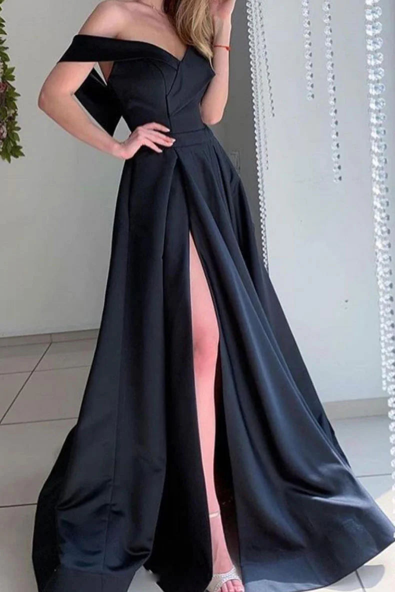 Woman wearing an elegant black off-shoulder long satin prom dress.
