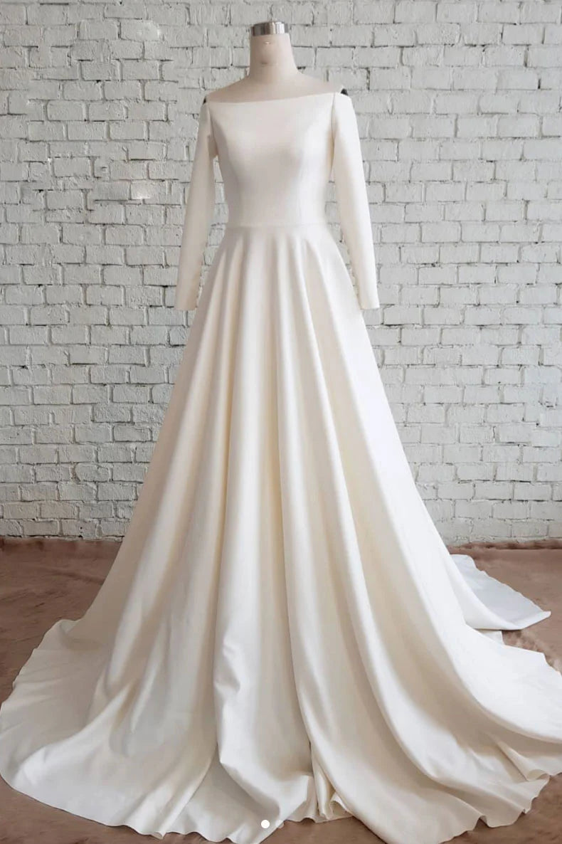 Model wearing an elegant white satin long prom dress, front view.