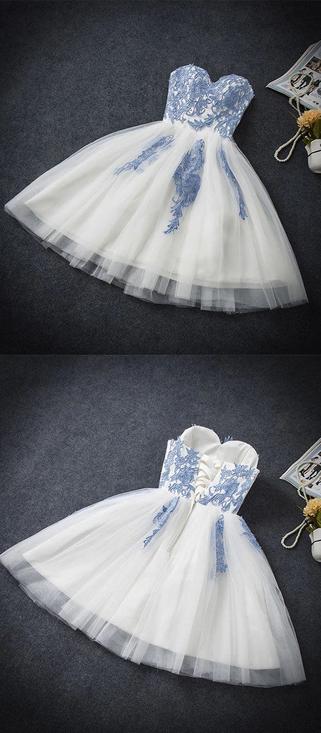 Close-up of the blue tulle fabric and sweetheart neckline of the dress.