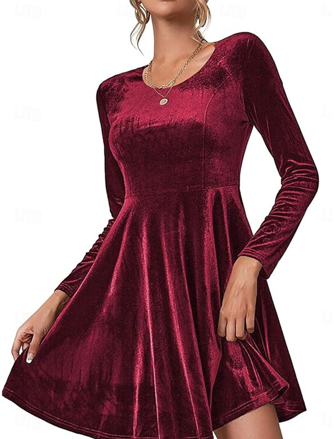 Back view of black long-sleeve bodycon dress with A-line skirt.