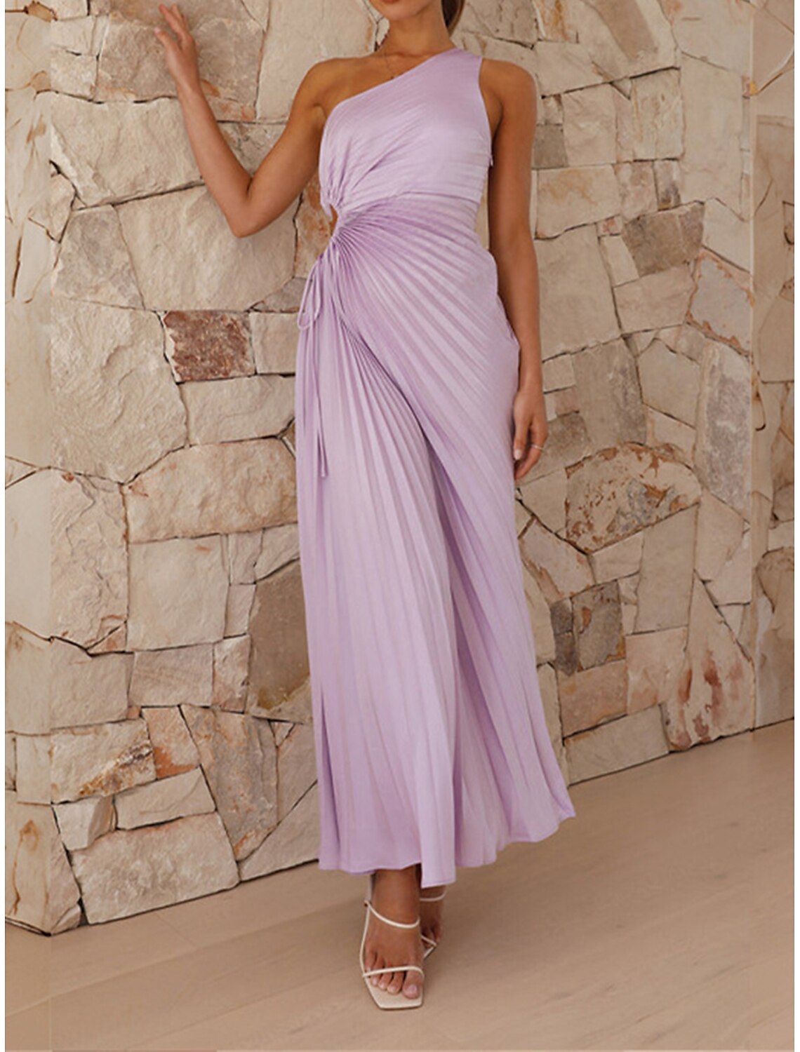 Elegant purple one-shoulder prom dress with cut-out and pleated details.