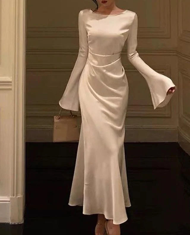 Elegant white flare sleeve mermaid wedding dress on a model.