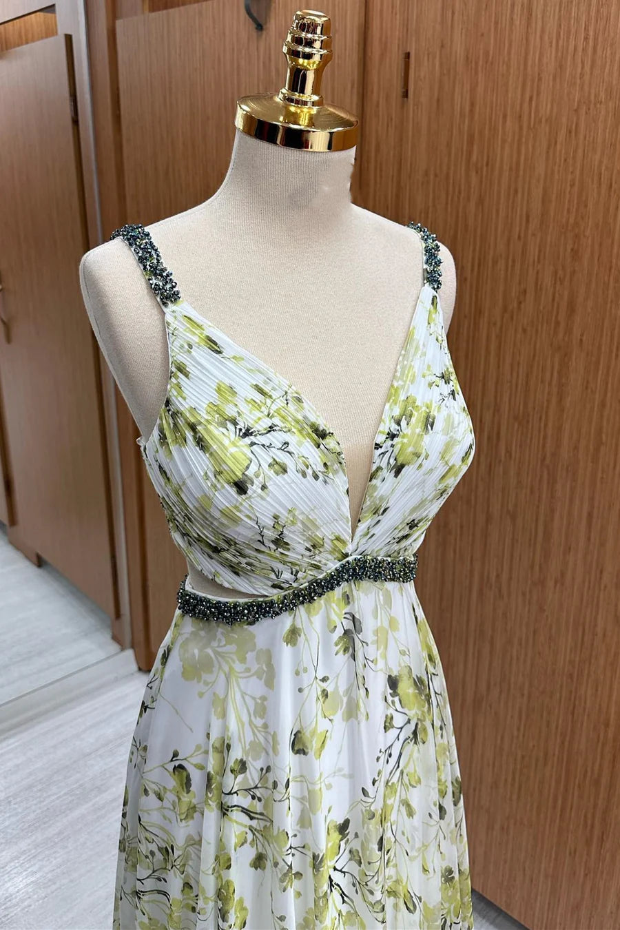 Model showcasing the flowing silhouette of a floral print chiffon maxi dress.