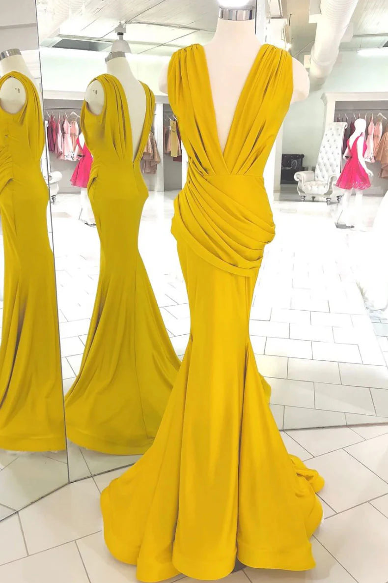 Woman wearing an elegant yellow V-neck long prom dress.