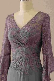 Full view of an elegant grey V-neck mermaid mother of the bride gown with ruffled sleeves and intricate lace bodice.