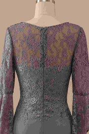 Side view of the grey mermaid gown, highlighting the intricate lace bodice and delicate ruffled sleeve detail.