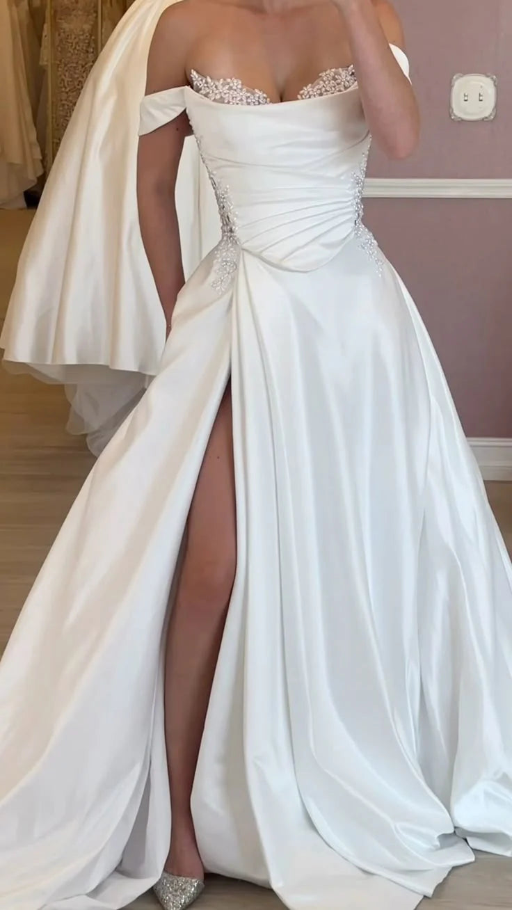 Elegant A-line off-shoulder wedding dress with lace bodice and long satin skirt.