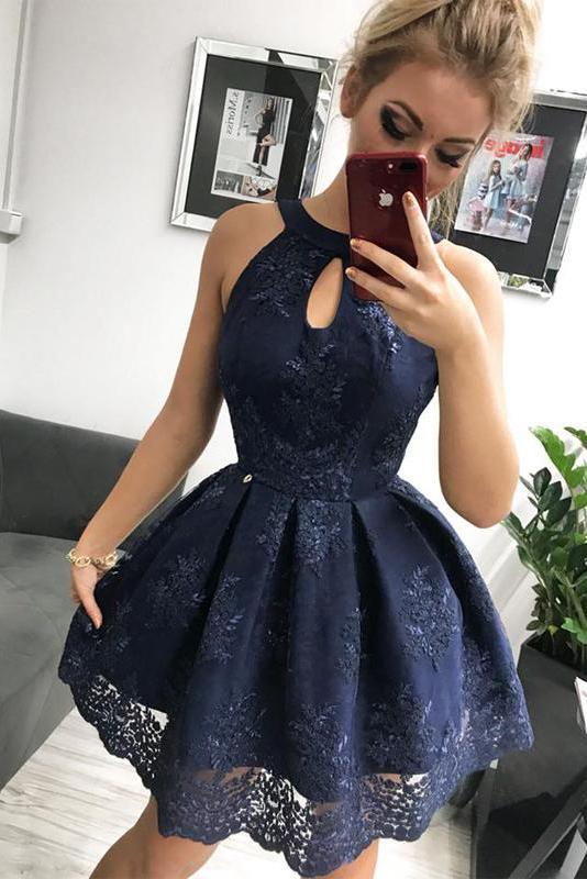 Model wearing a navy blue lace sweetheart sleeveless mini homecoming dress.