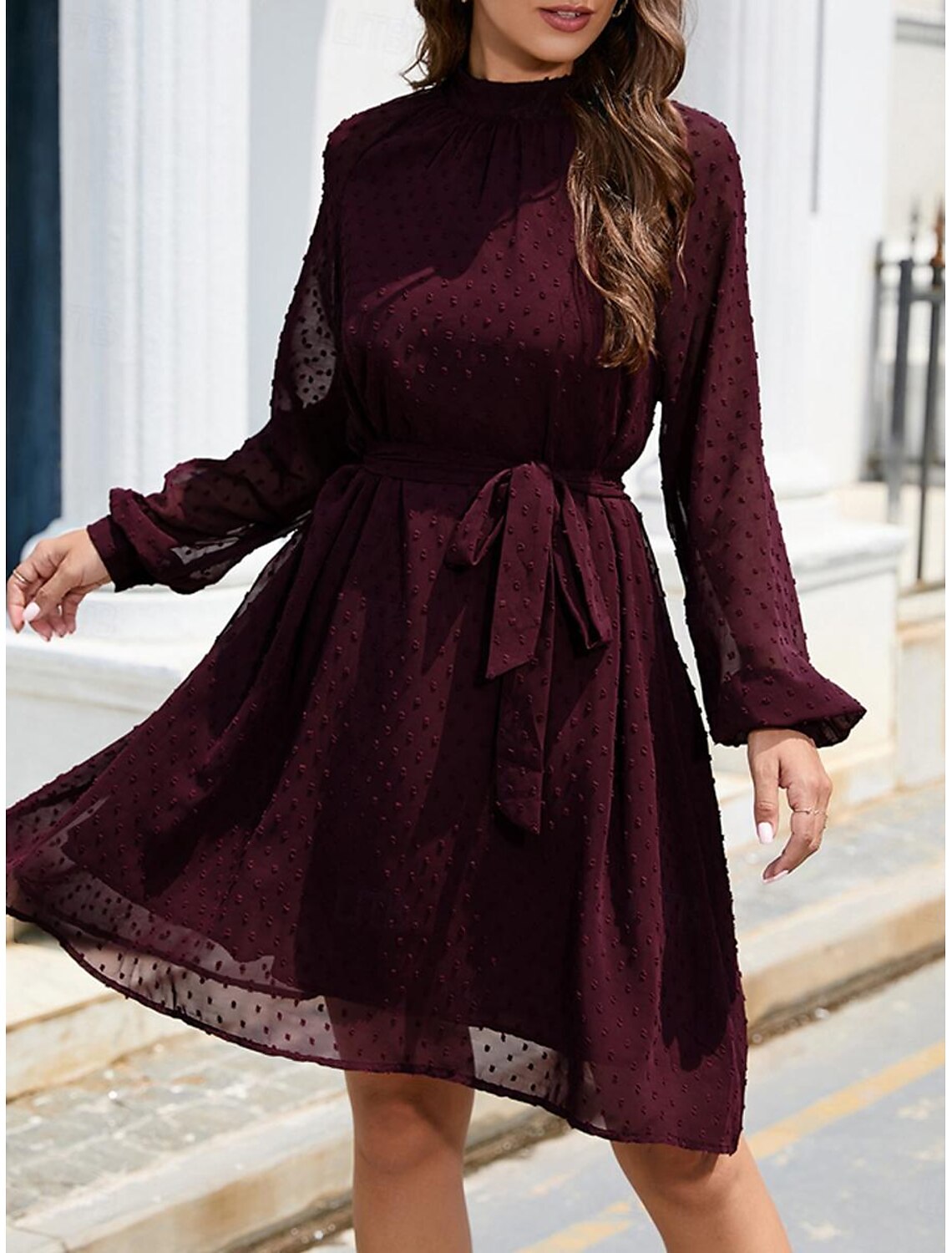 Model wearing an elegant lace-up chiffon mini dress with short sleeves.