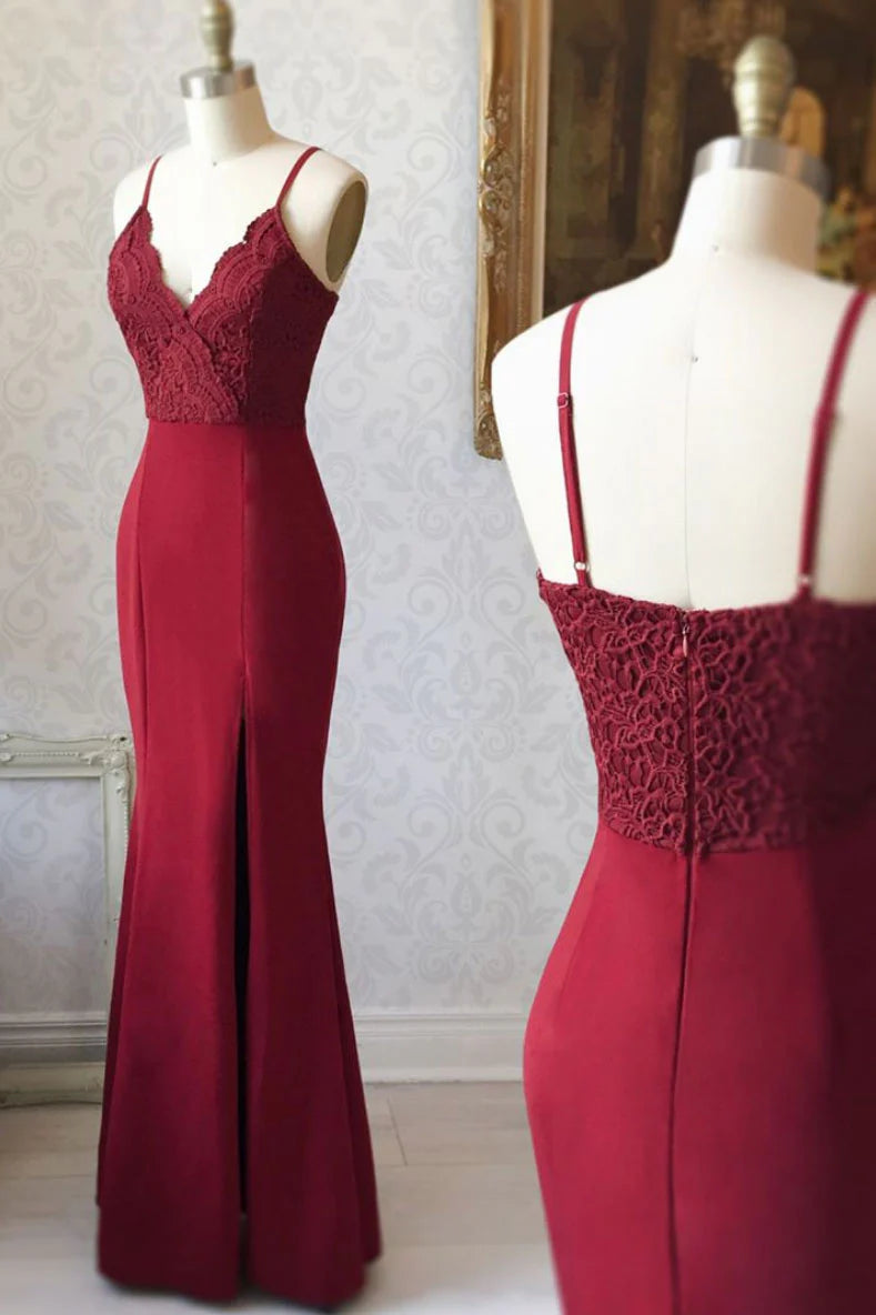 Woman wearing a burgundy V-neck lace mermaid long prom dress.