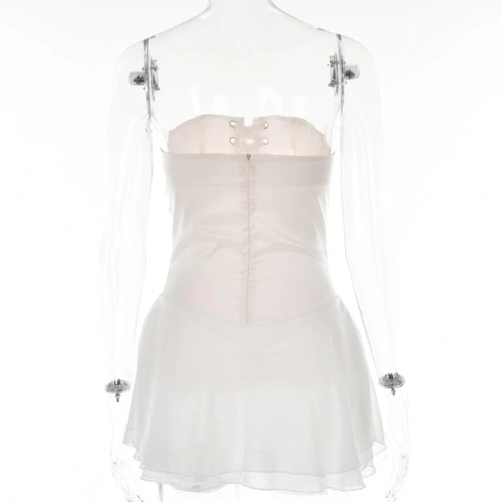 Back view of the light pink mini homecoming dress showing lace-up corset detail.