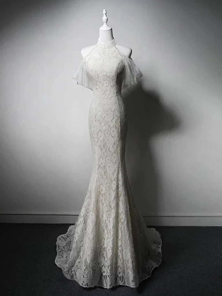 Model wearing a white mermaid high neck lace long prom evening gown, front view.