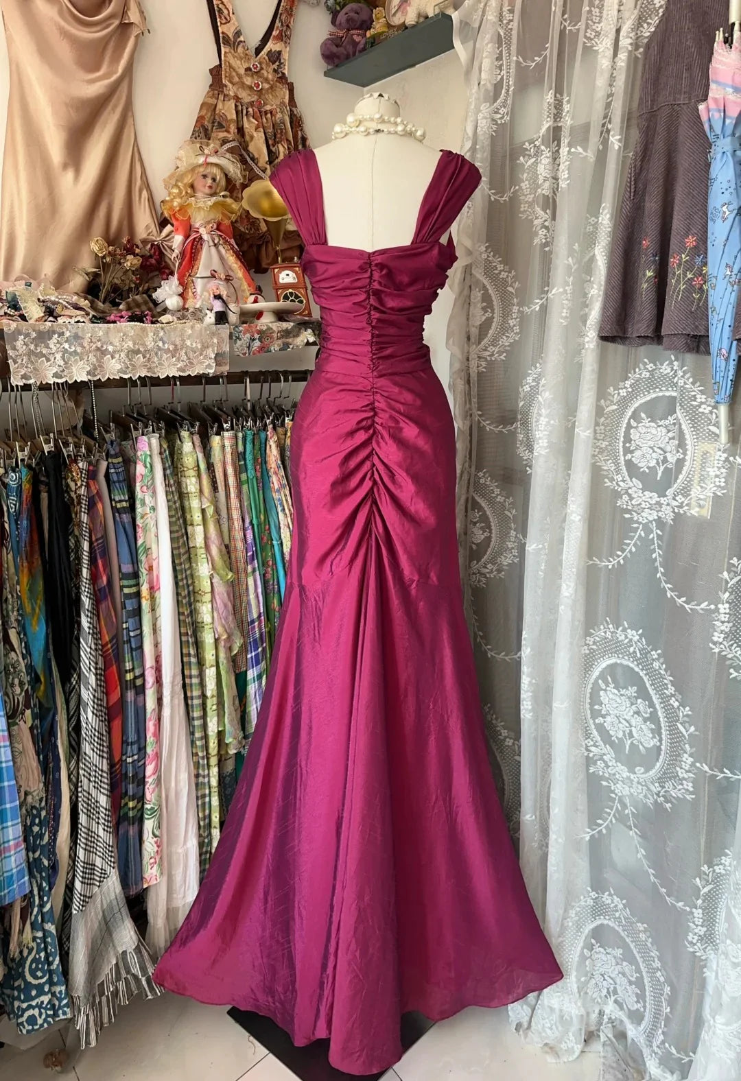 Full view of the mermaid evening dress, showcasing its flattering silhouette and unique folded detail.
