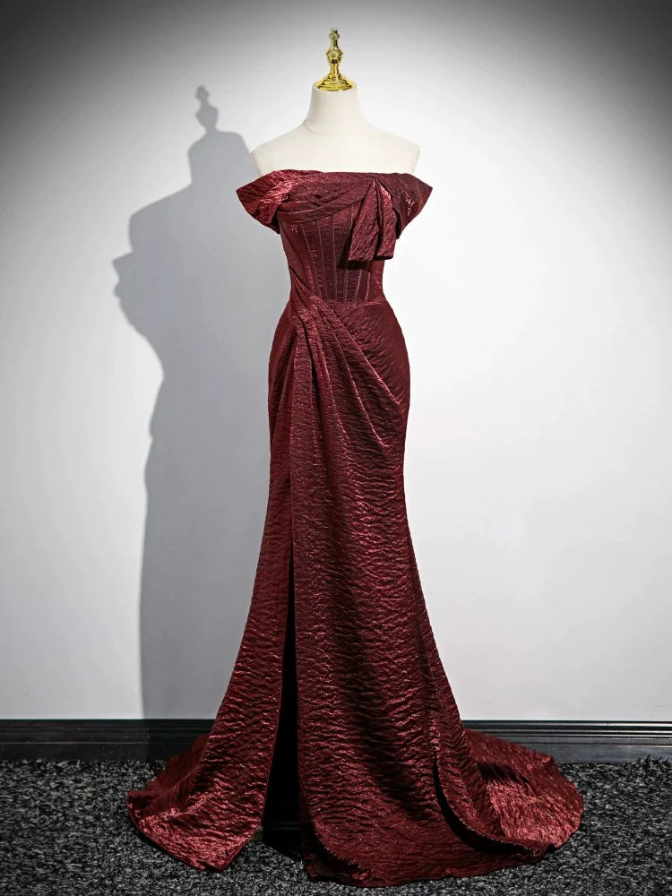 Model wearing a burgundy mermaid off-shoulder long prom dress, front view.