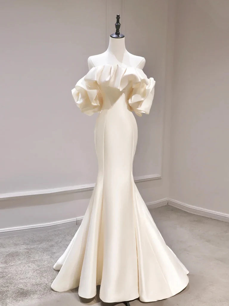 Model in an elegant light champagne mermaid off-shoulder satin long prom gown.