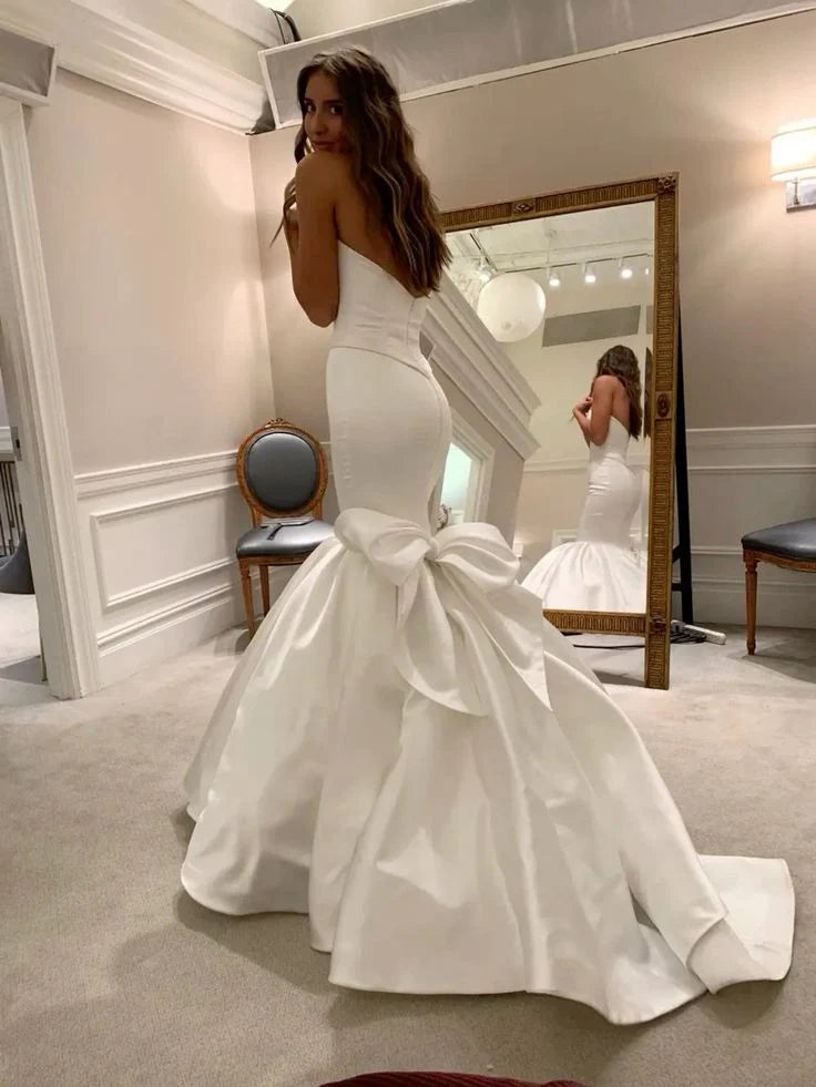 White mermaid wedding dress showcasing the sweetheart strapless neckline and fitted bodice.