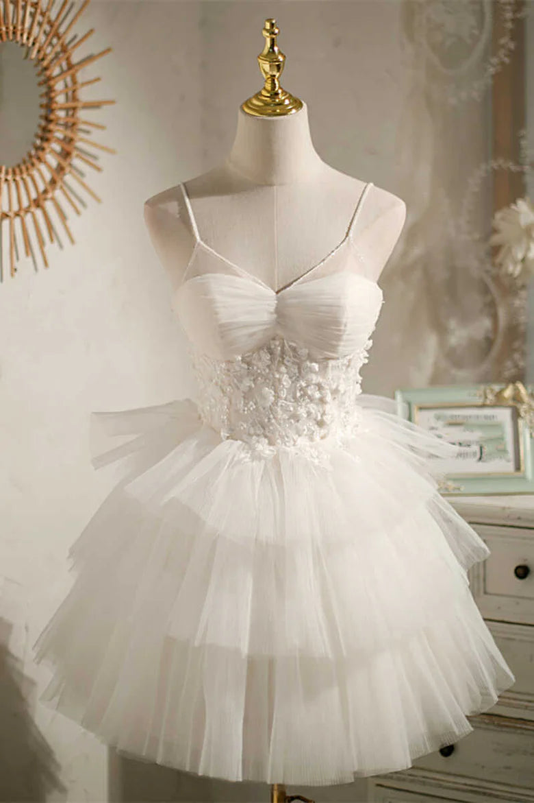 White multi-tiered tulle short party dress with V-neck and lace-up back.