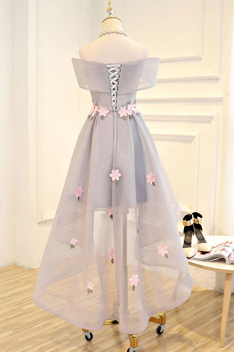 Full view of the gray off-shoulder high-low evening dress with intricate applique.