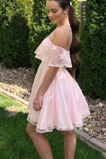Model wearing an elegant off-shoulder pink lace short party dress, side view.