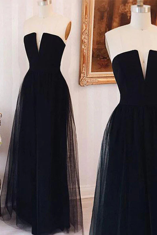 Model wearing an elegant off-shoulder black tulle long prom dress.